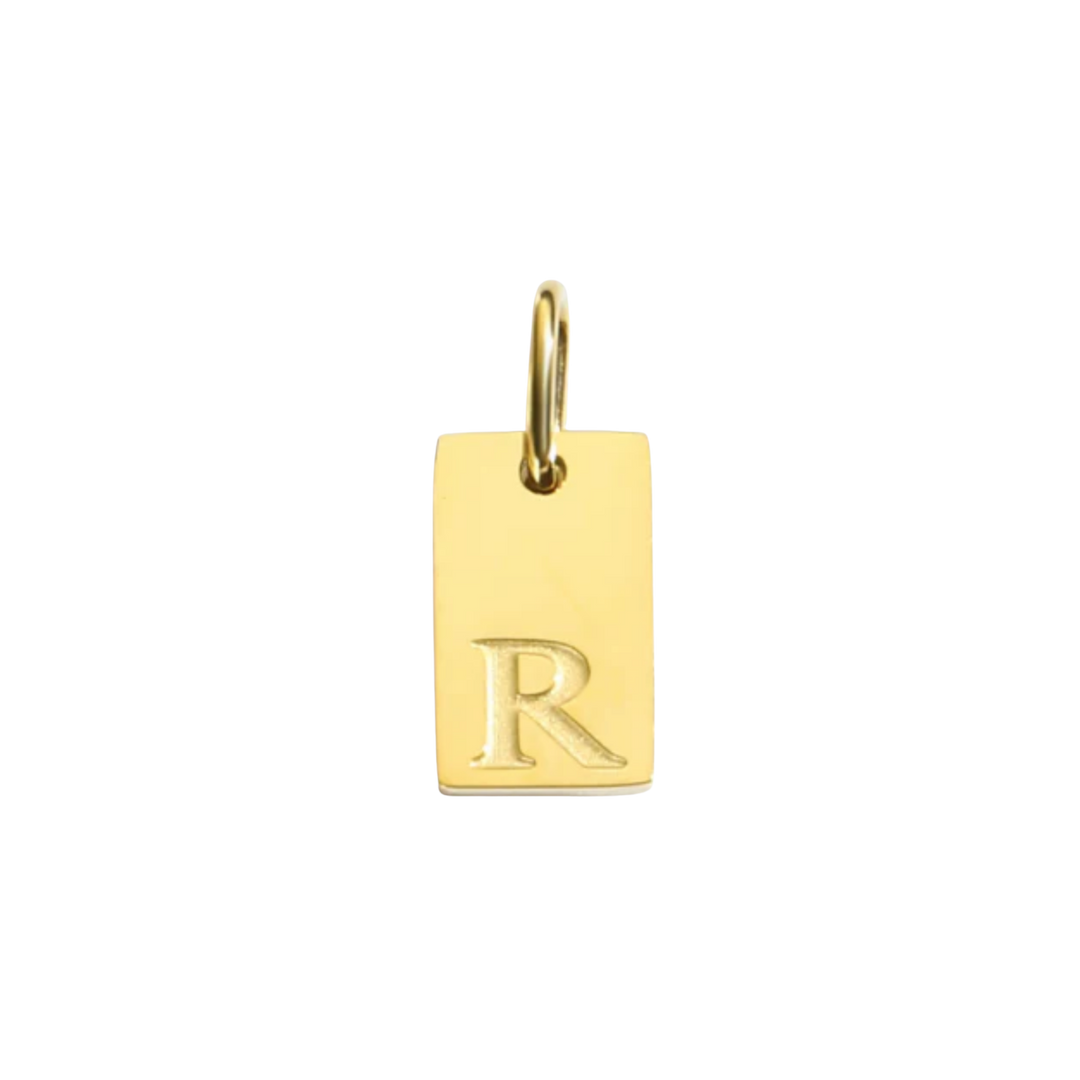 Gold pendant with letter 'R' on a white background