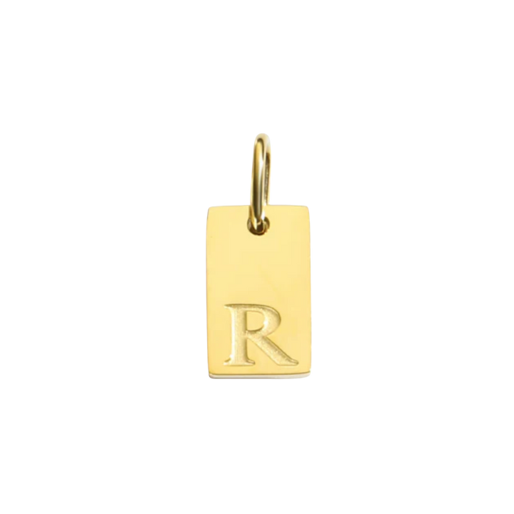 Gold pendant with letter 'R' on a white background