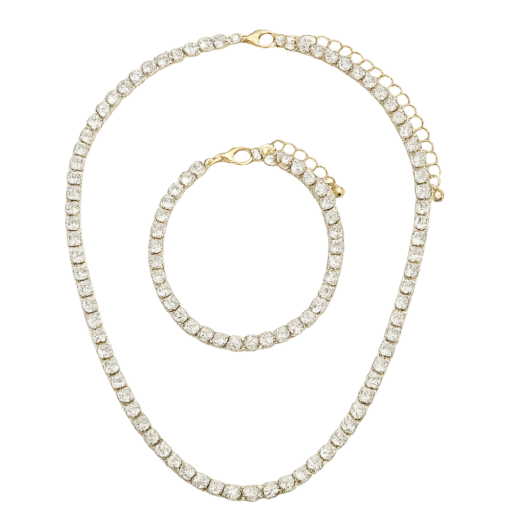 Gold necklace and bracelet set with clear gemstones on a white background