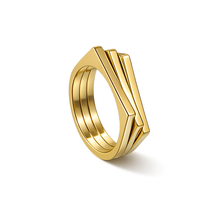 Gold ring with geometric design on a white background