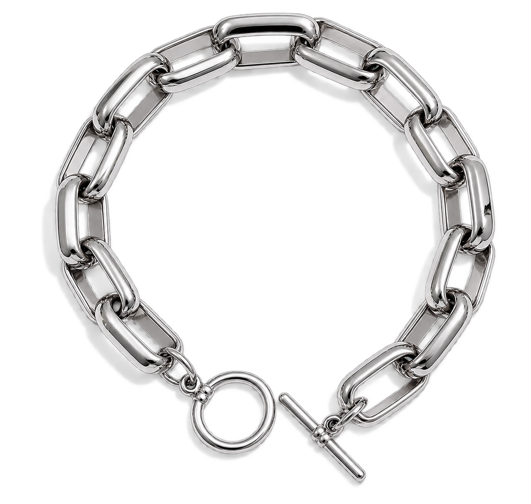 A silver-toned chunky chain link bracelet with a toggle clasp and circular ring detail, displayed on a clean white background.