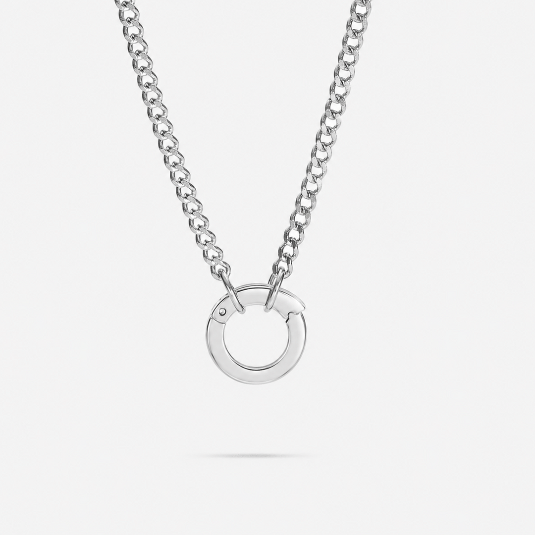 Silver necklace with a circular pendant on a white background