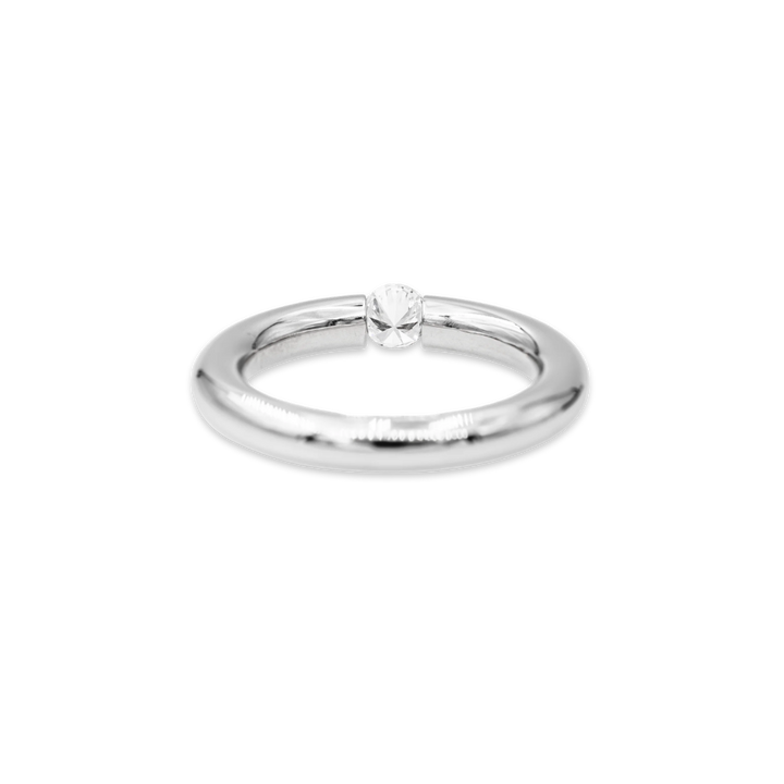 Silver ring with a small diamond on a white background