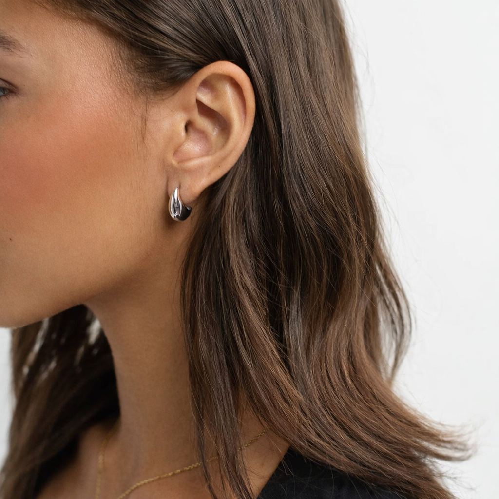 silver dome earring side on model