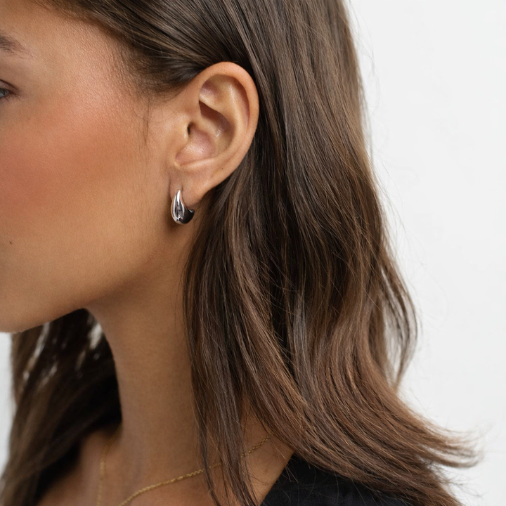 silver dome earring side on model