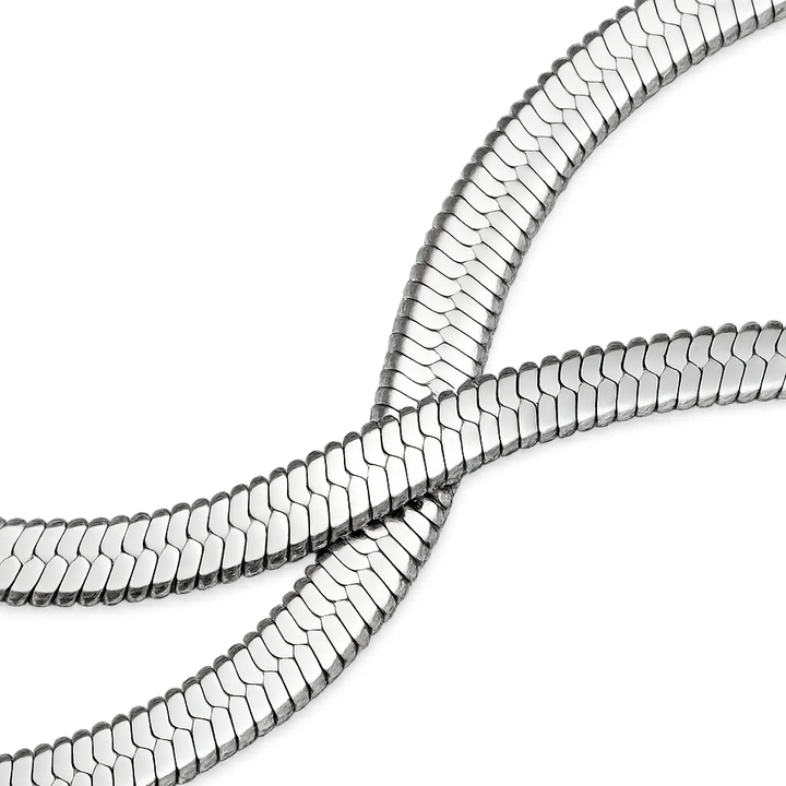 Metallic snake skin pattern on a white background