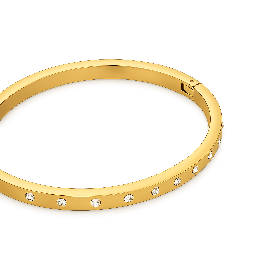Gold bracelet with embedded crystals on a white background