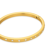 Gold bracelet with embedded crystals on a white background