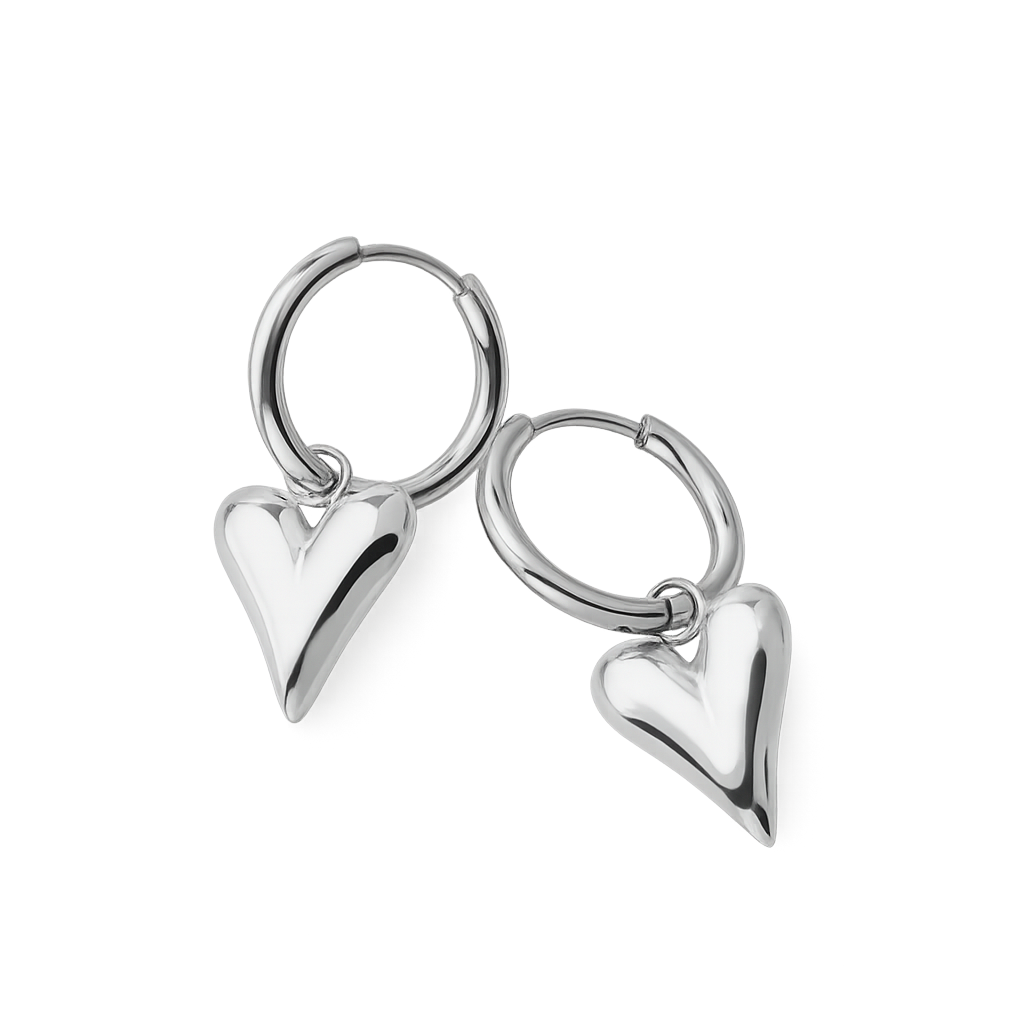 Pair of silver hoop earrings with heart-shaped pendants on a white background