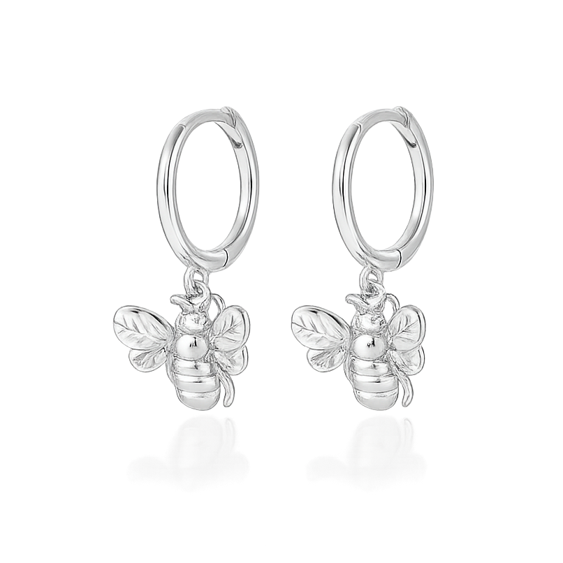Silver bee-shaped hoop earrings on a white background