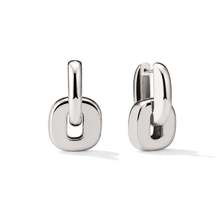A pair of polished silver huggie hoop earrings with a thick, rounded square link design, shown on a clean white background.
