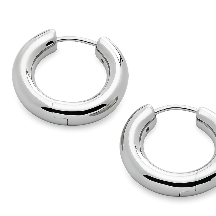Pair of silver hoop earrings on a white background