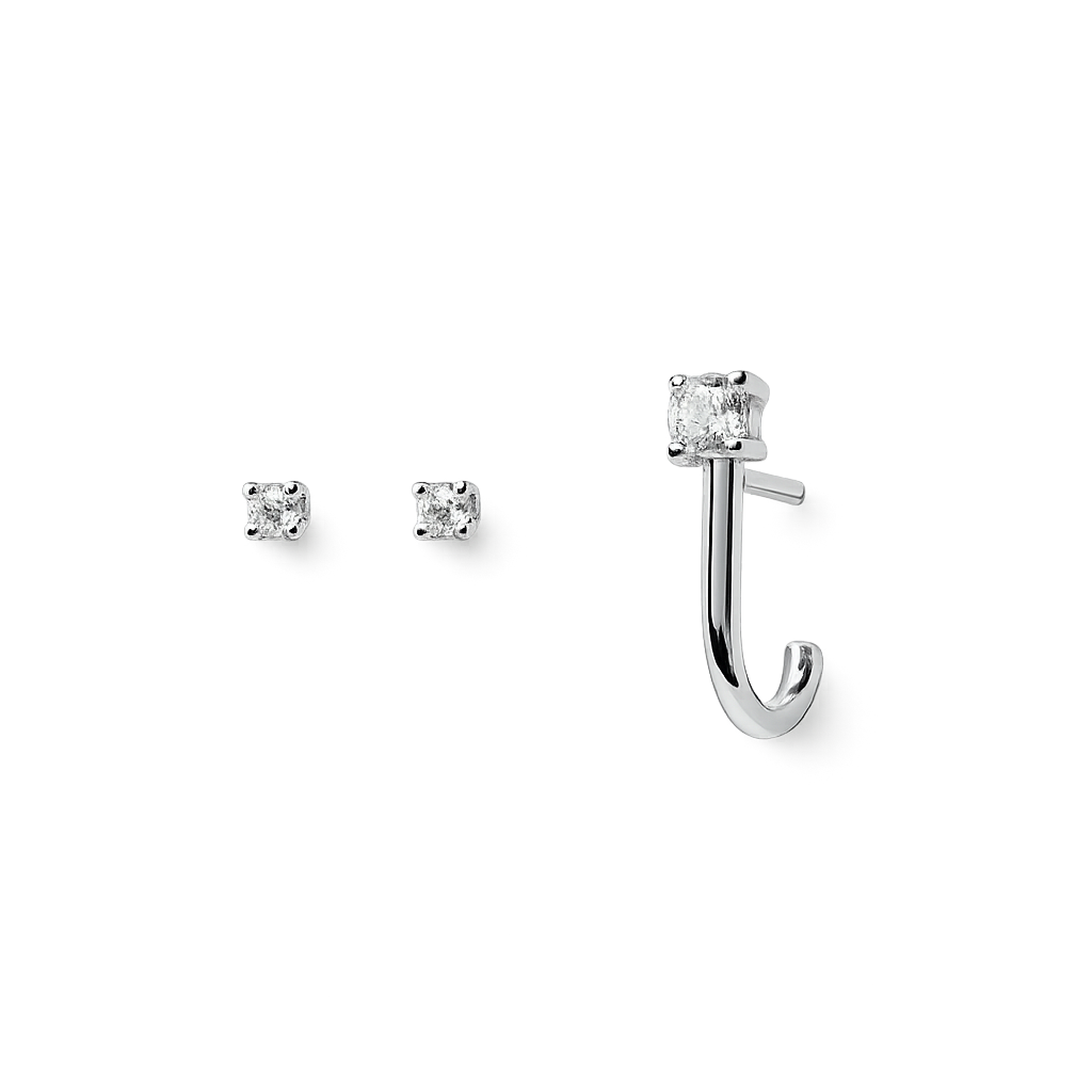 Silver earring set with clear gemstones on a white background