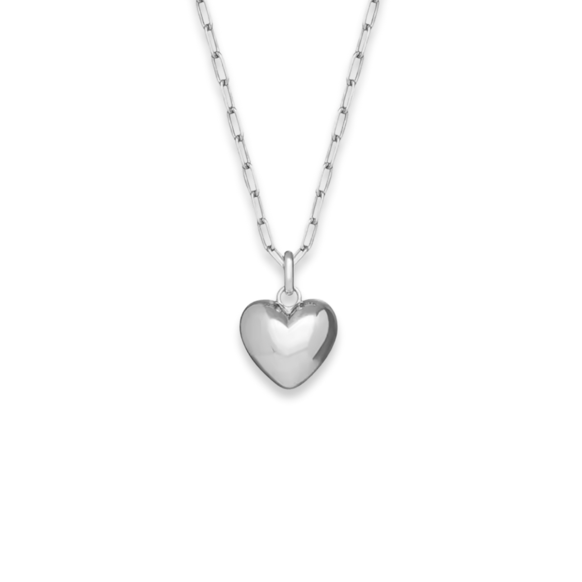 A polished silver heart pendant necklace on a delicate silver link chain, shown against a solid white background.