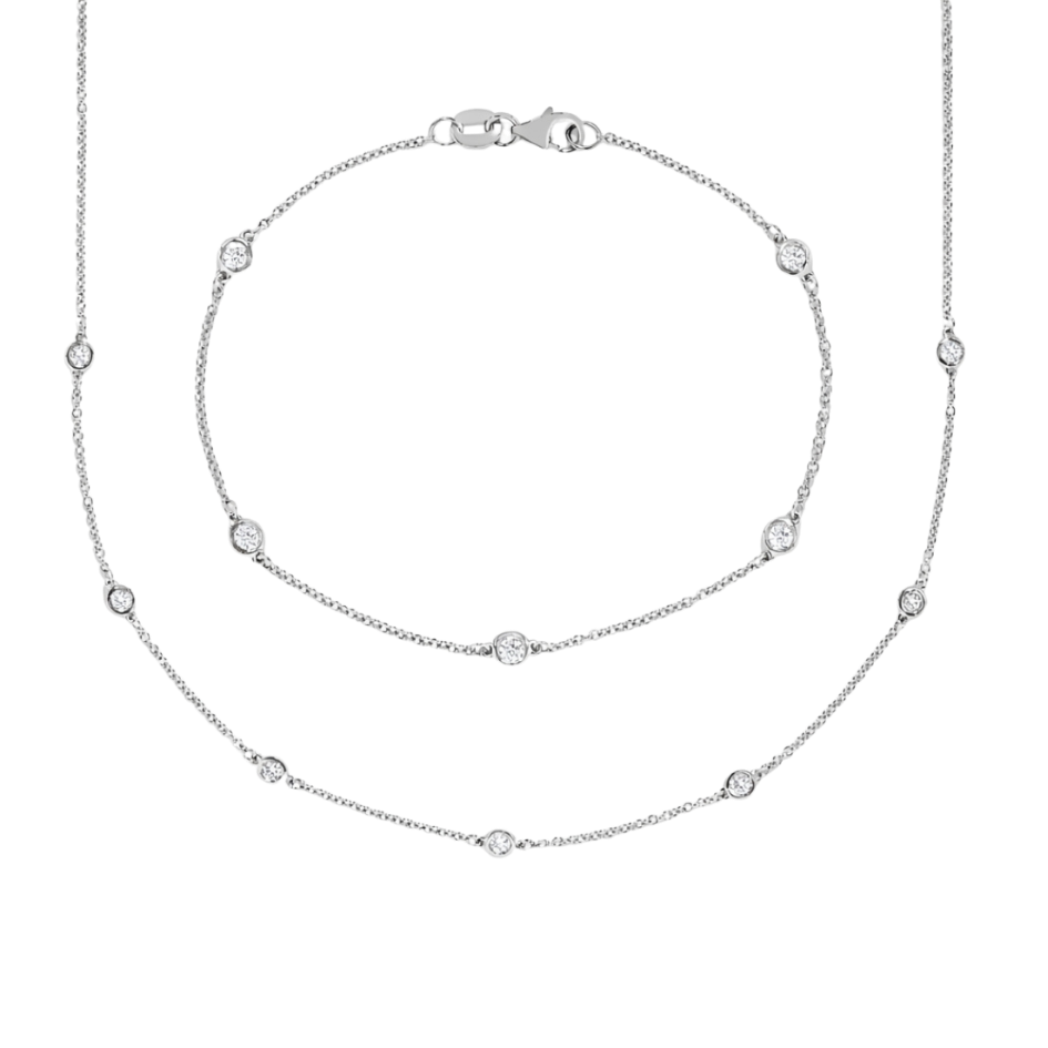 Silver necklace with small beads on a white background