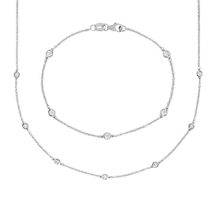 Silver necklace with small beads on a white background