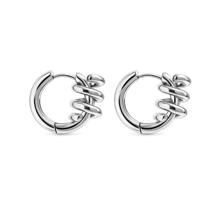 Pair of silver hoop earrings with intricate design on a white background