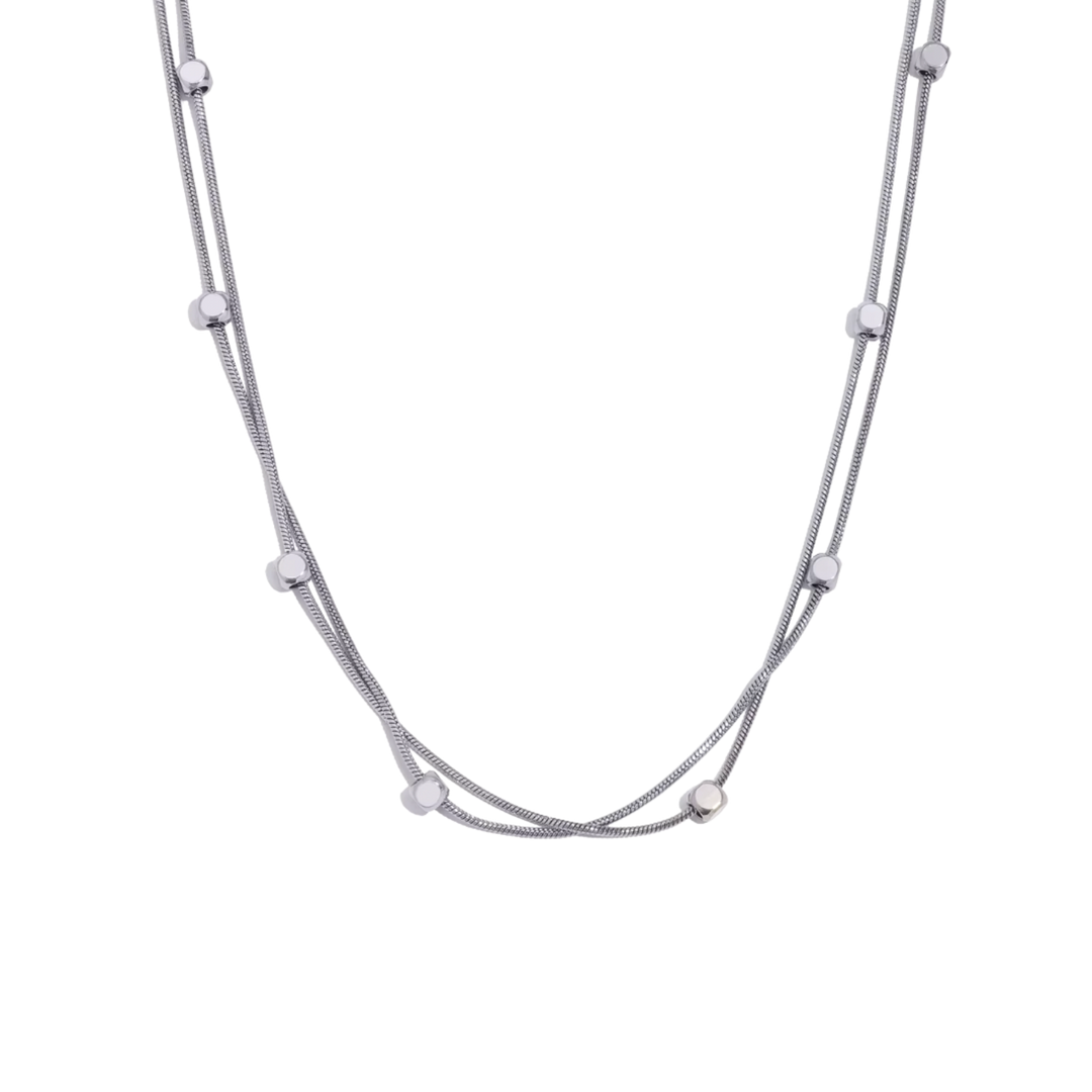 Silver necklace with small beads on a white background