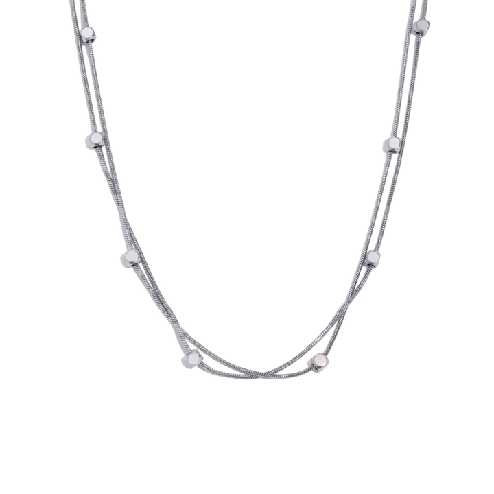 Silver necklace with small beads on a white background