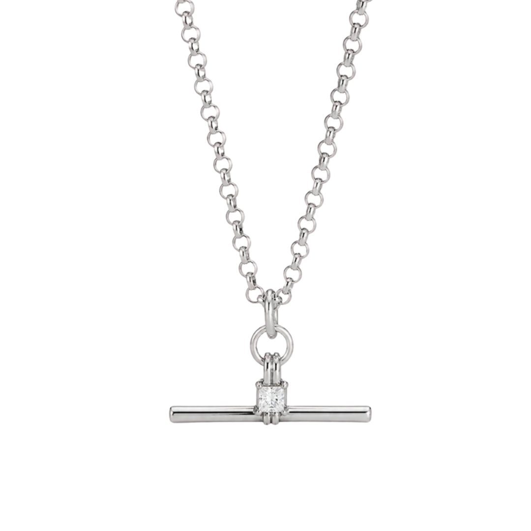 A silver-toned necklace featuring a delicate chain and a horizontal bar pendant with a single square-cut clear gemstone in a prong setting, shown against a plain white background.