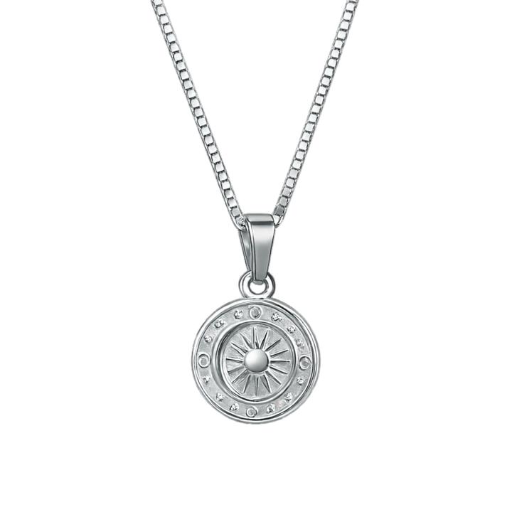 Silver necklace with a round pendant on a white background