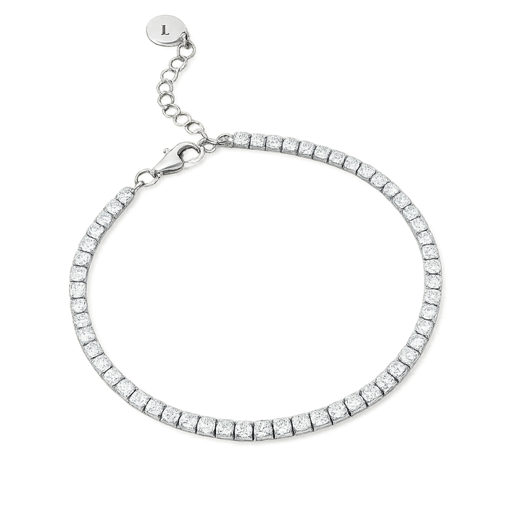 Silver tennis bracelet with clear stones on a white background