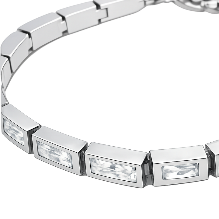 Silver bracelet with rectangular crystals on a white background