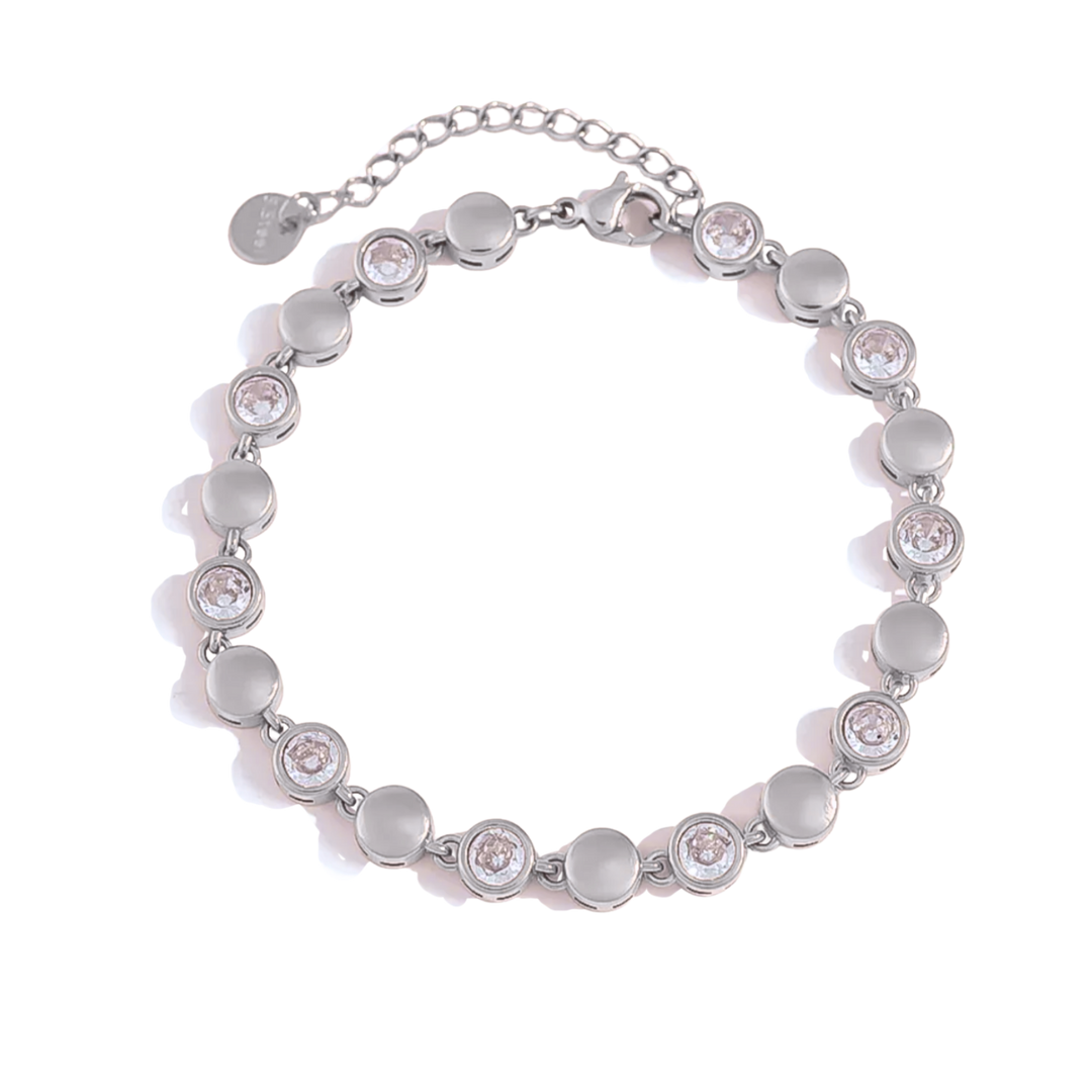 A silver-toned beaded bracelet with alternating smooth round beads and round bezel-set clear crystals, displayed on a clean white background.