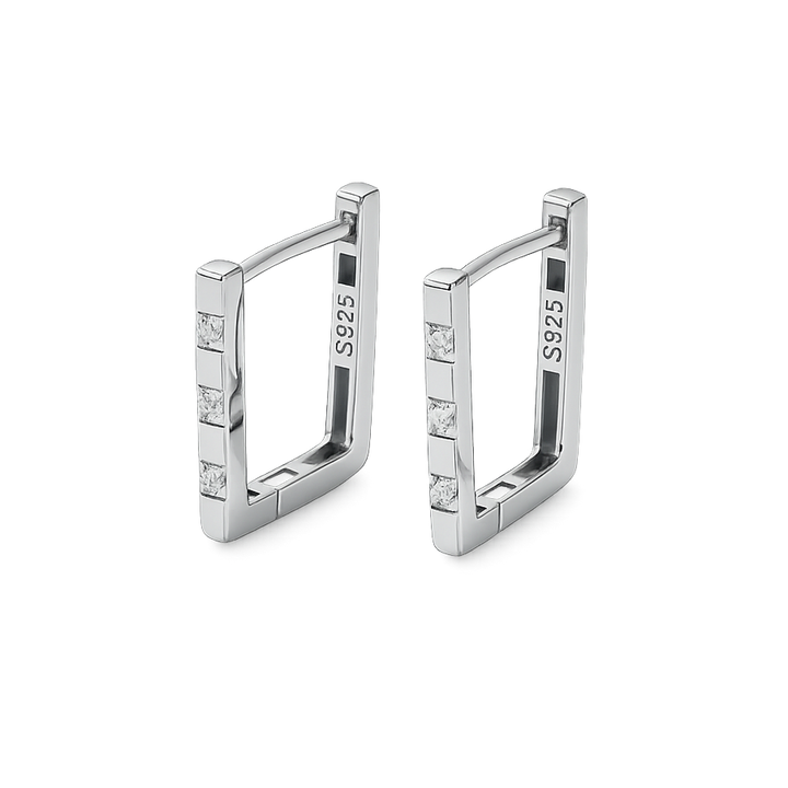 Pair of silver hoop earrings with small diamonds on a white background