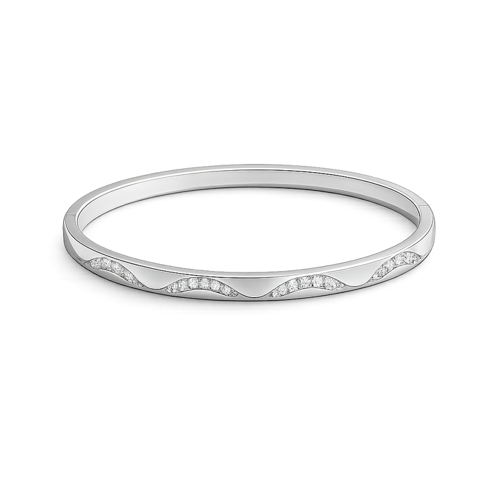 Silver bracelet with a subtle pattern on a white background