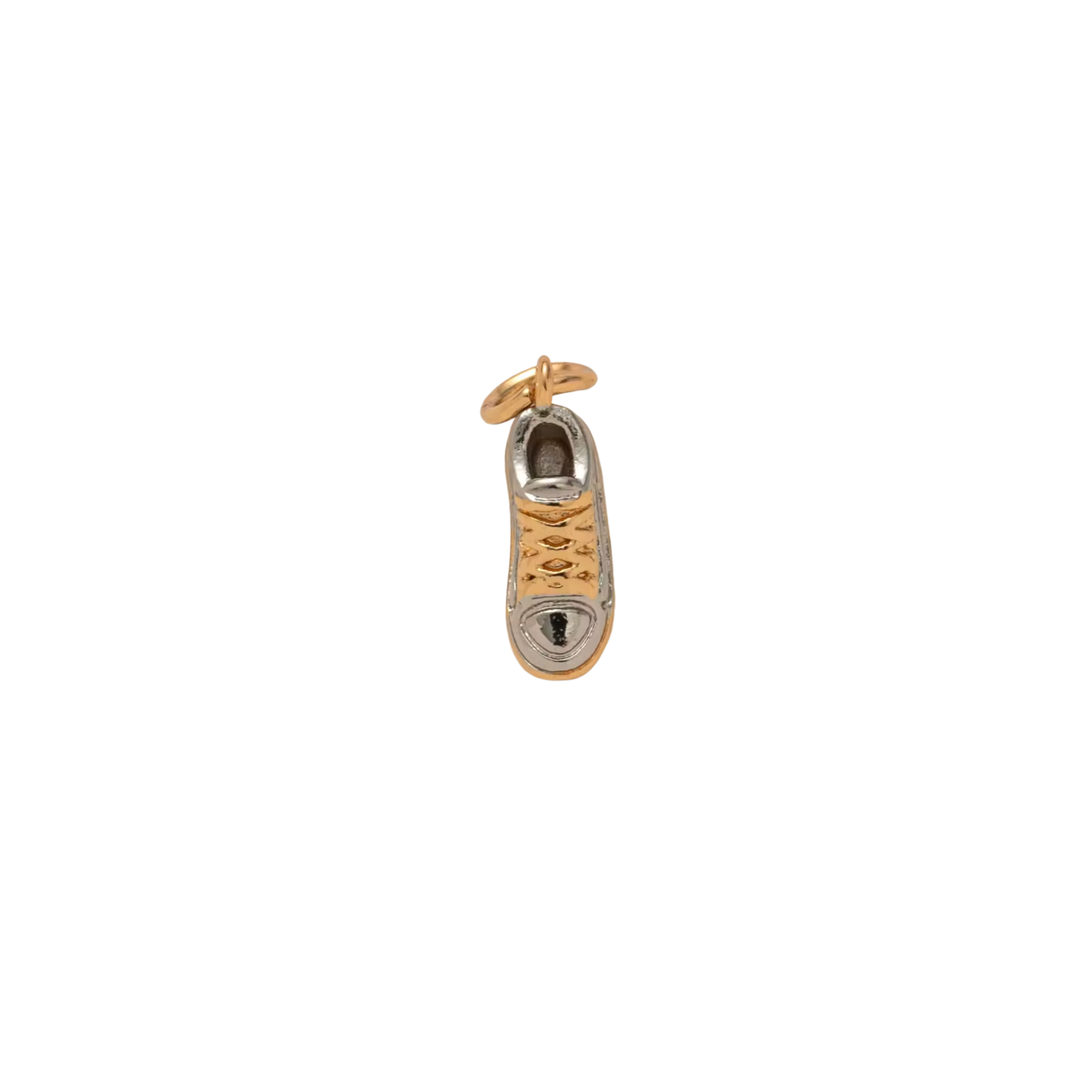 Gold and silver shoe charm on a white background