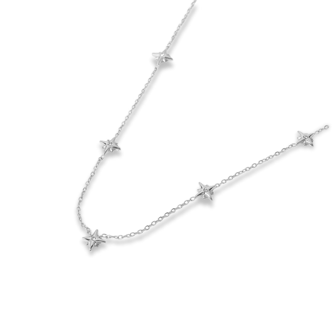 Silver star-shaped necklace on a white background