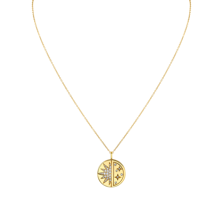 Gold necklace with a circular pendant on a white background