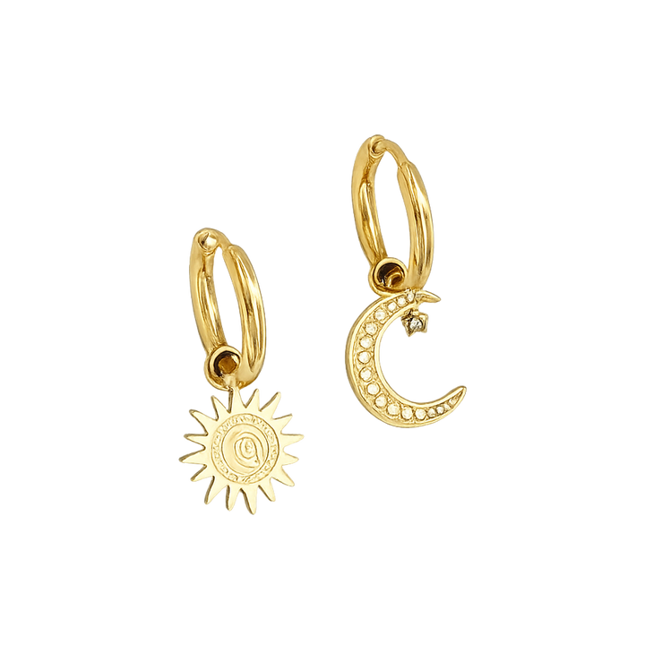Gold hoop earrings with sun and moon charms on a white background