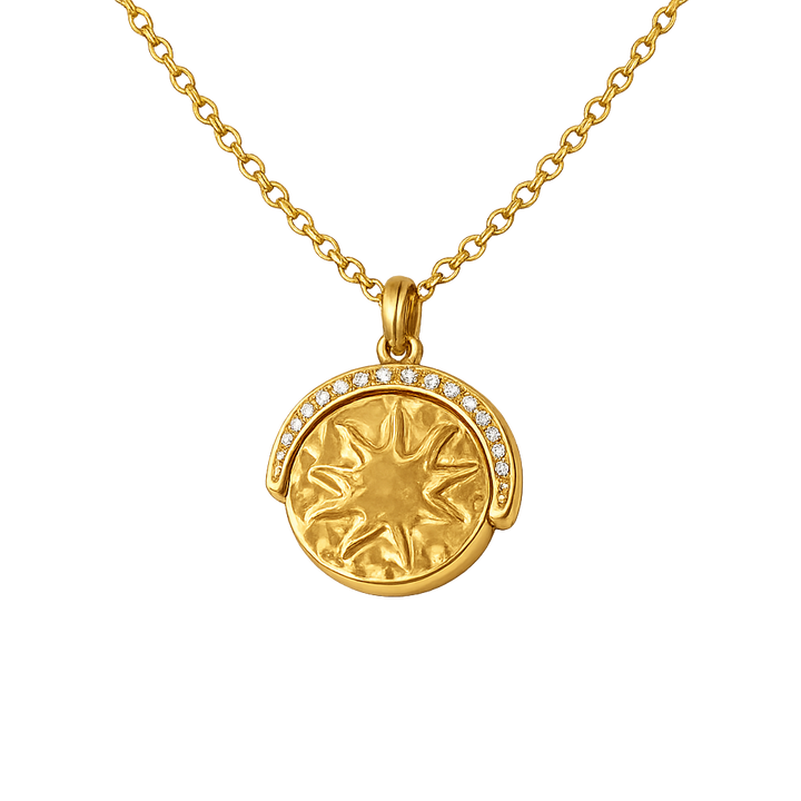 Gold necklace with a sun-shaped pendant on a white background