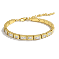 Gold bracelet with embedded diamonds on a white background