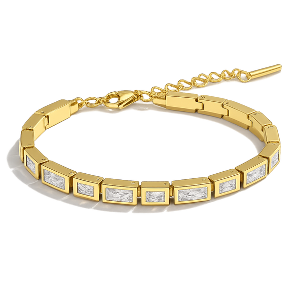 Gold bracelet with embedded diamonds on a white background