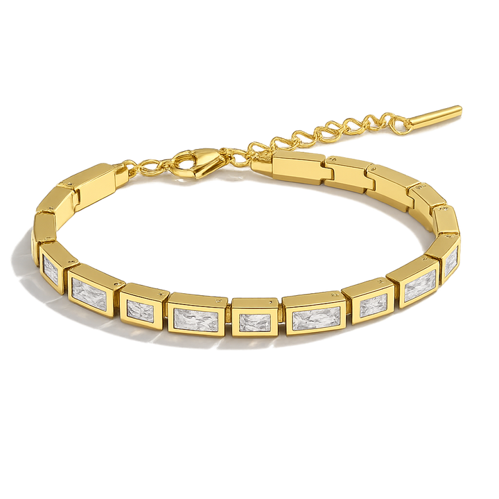 Gold bracelet with embedded diamonds on a white background