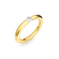 Gold ring with a diamond on a white background