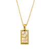 Gold necklace with a rectangular pendant featuring 'The Moon' design on a white background