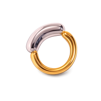 Two-toned ring with silver and gold colors on a white background