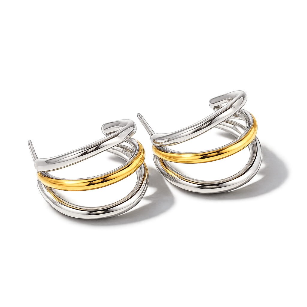 Pair of silver and gold hoop earrings on a white background