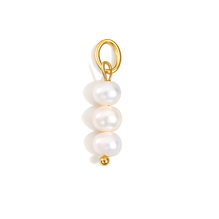 Pearl charm with gold clasp on a white background