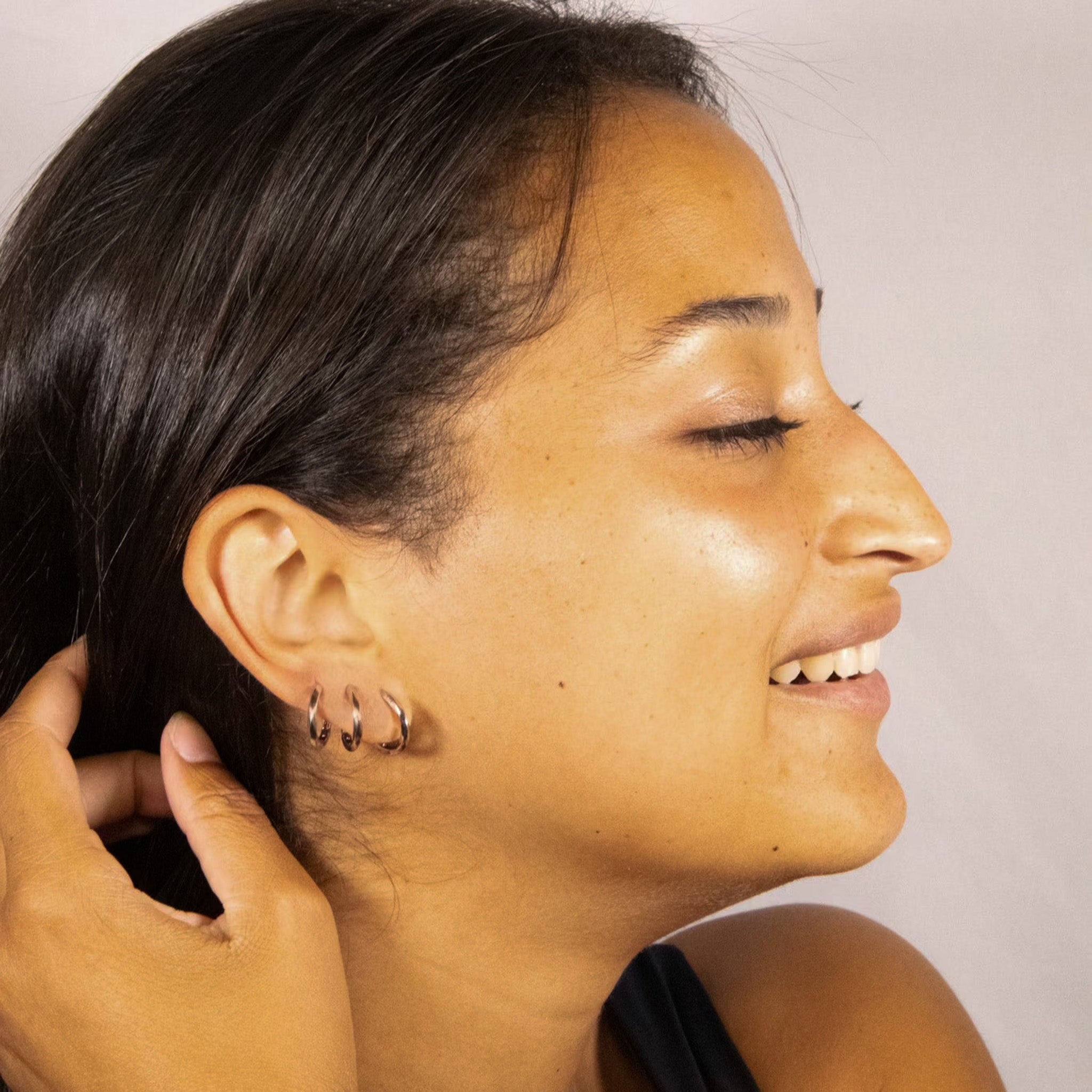 Sustainable twisted mini hoops in gold or silver, comfortable enough to sleep  in. The perfect gift.