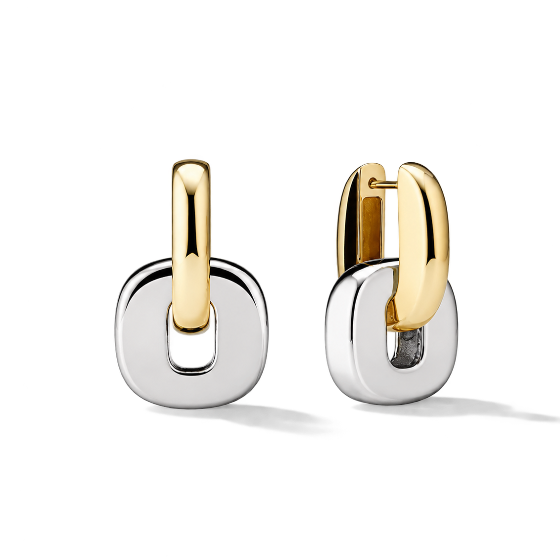 Two two-tone hoop earrings with polished gold and silver finishes, displayed on a clean white background.