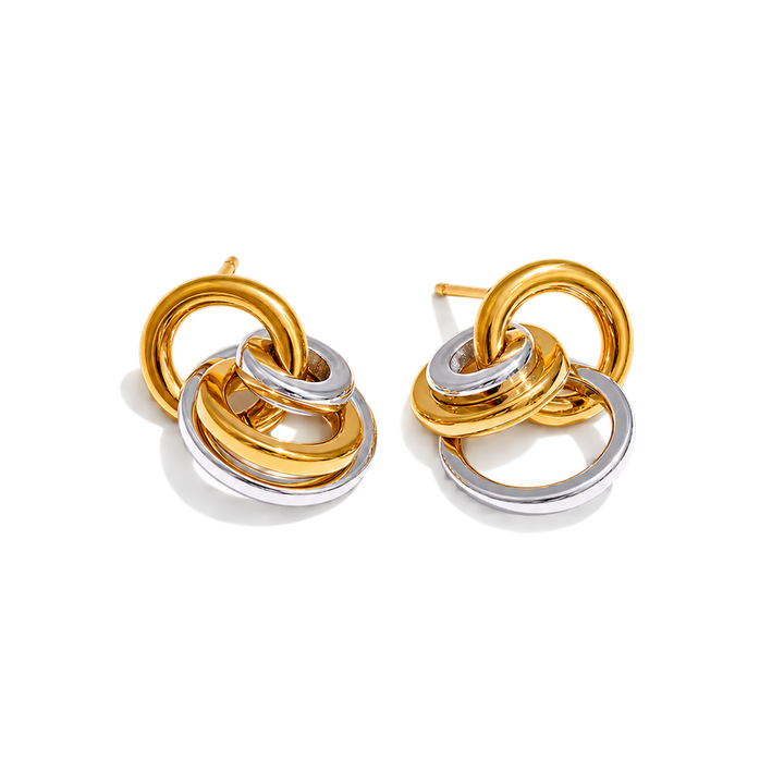 A pair of gold and silver interlocking ring stud earrings on a clean white background.