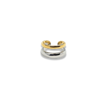 Two-toned ear cuff with gold and silver bands on a white background