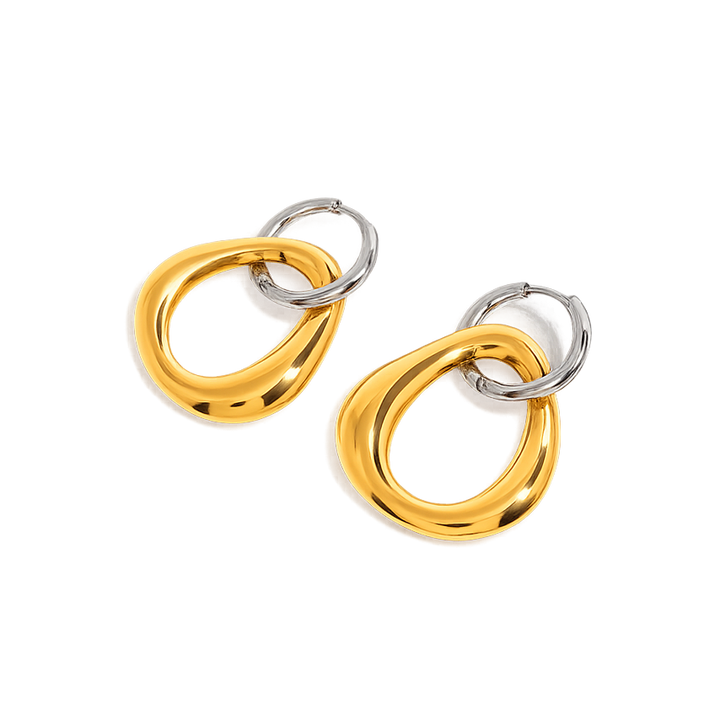 Gold and silver hoop earrings on a white background