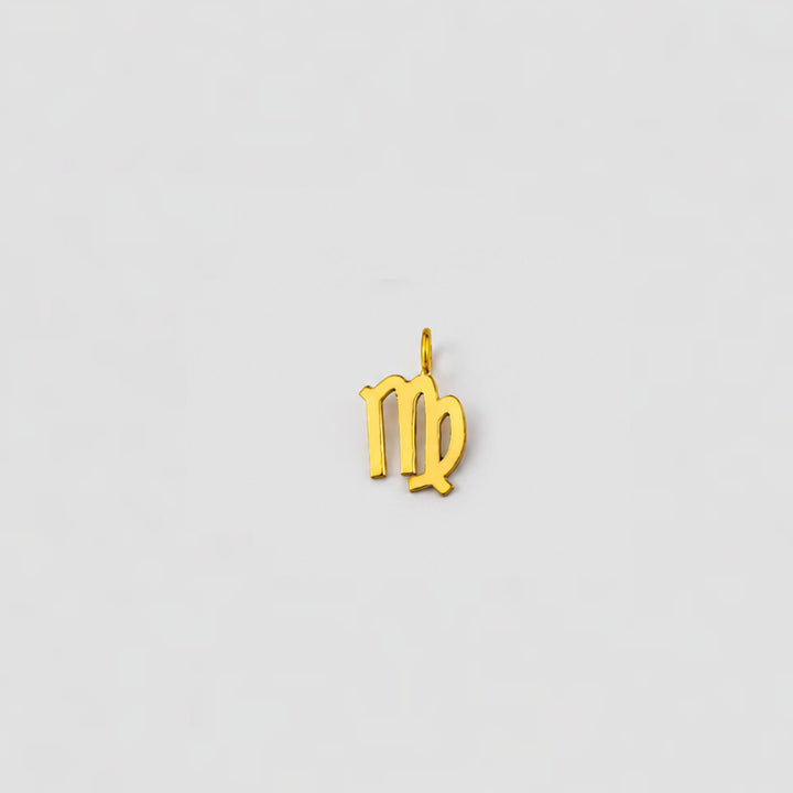 Gold Virgo zodiac pendant on a light gray background