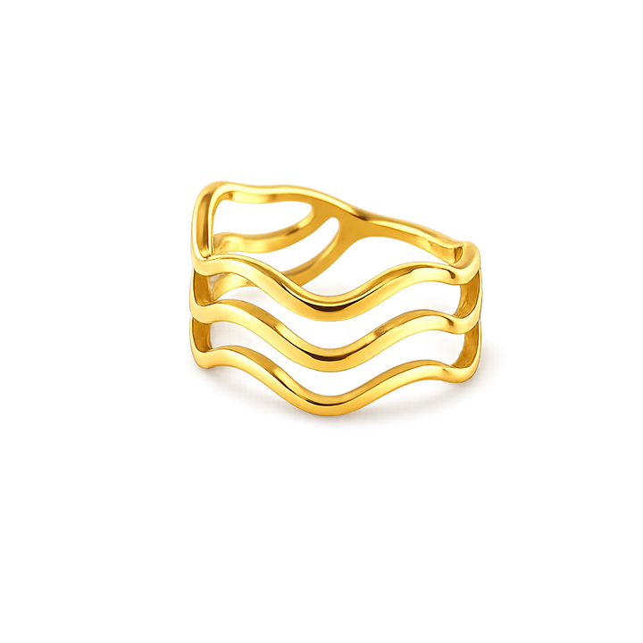 Gold ring with wavy design on a white background